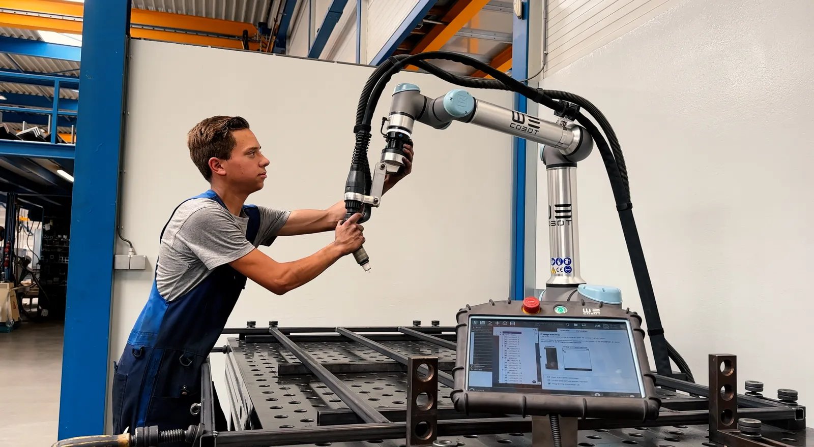 Maarten-Littel-young-man-with-cobot