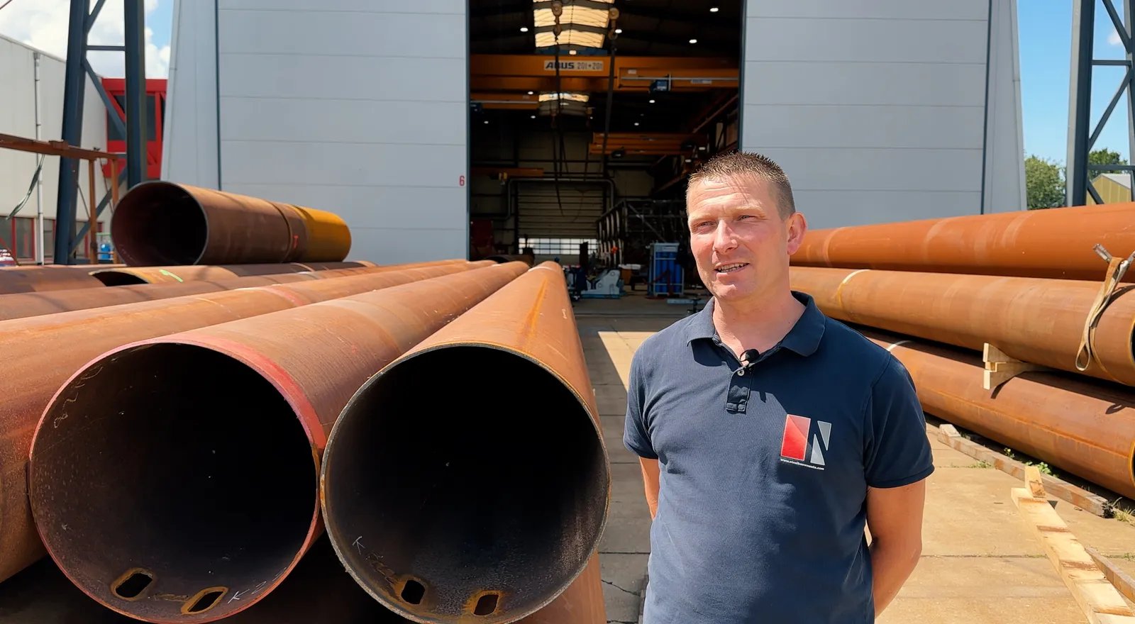 Nauta-Heeg-man-standing-in-front-of-metal-pipes